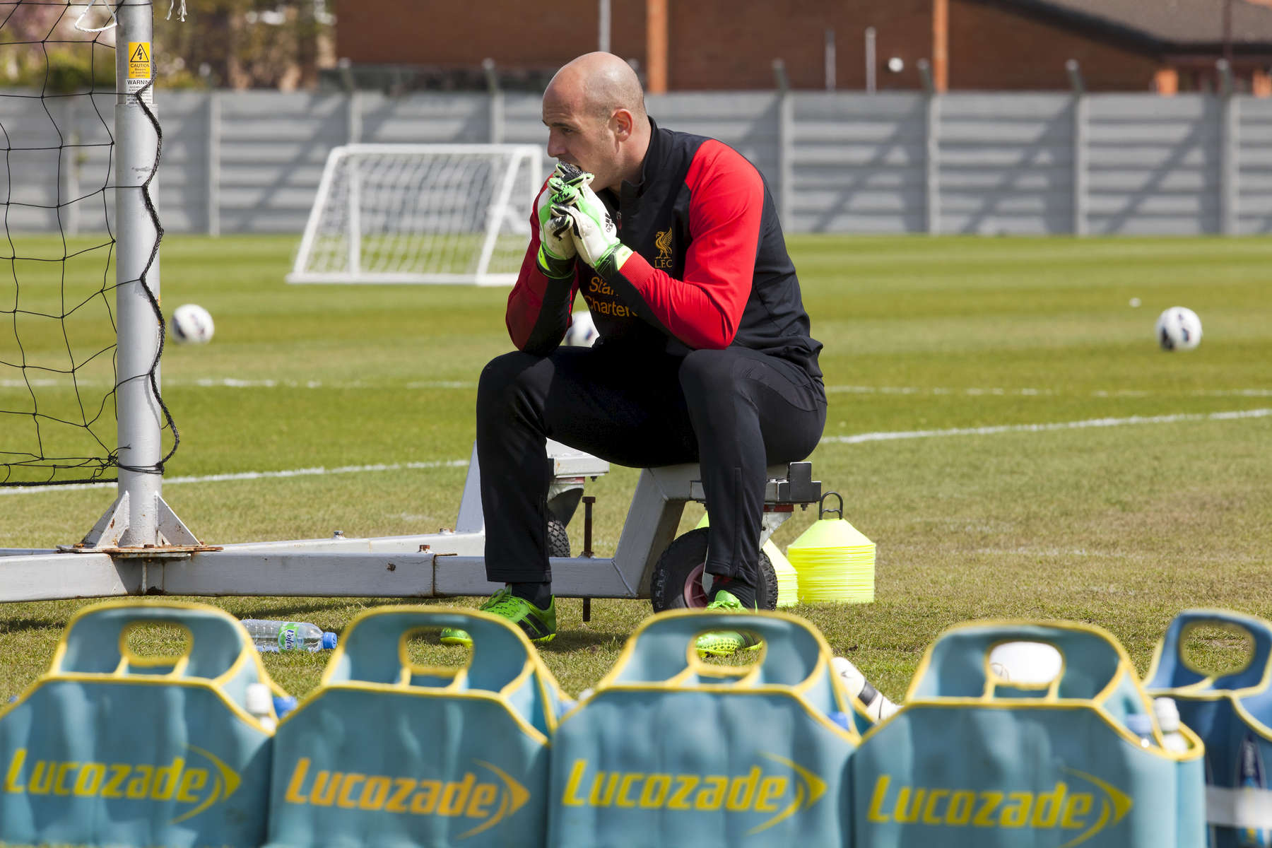 Liverpool FC goalkeeper Pepe Reina takes a break from training at Melwood.Melwood is the Liverpool FC training ground, located in the West Derby area of Liverpool. It is seperate from the Liverpool Academy, which is based in Kirkby.Melwood was redeveloped in the early 2000′s with large input from then-manager Gerard Houllier and now features some of the best facilities in Europe. It has been the club’s training ground since the fifties and was previously transformed into a top class facility by Bill Shankly.Facilities include sythetic pitches, rehabilitation rooms, press and meeting rooms, gymnasium, swimming pool, restaurant and recreational facilities.