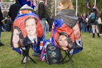 Two royal supporters sat in Parliament Square facing Westminster Abbey.