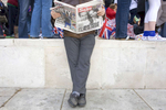 A man reads The Sun newspaper on the day of the Royal Wedding between William and Kate. The headline reads 'Mum Would Be So Proud' referring to the late Princess Diane, Williams mother.