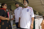Two Asian men wearing England football shirts in the crowd at an England cricket match at Lords. Lords Cricket ground in St. John's Wood north London is recognised as the home of cricket and the games spiritual headquarters.