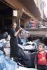 A young Zabaleen woman sorts through garbage collected from Cairo for useful items to recycle.Moqqatam is a suburb on the edge of Cairo and home to a people known as the Zabaleen, said to be the world’s greatest waste recyclers. The Zabaleen, which means plainly enough, “the garbage collectors”, pick up around 4,000 tons of Cairo’s waste each day. American researchers have shown that the Zabaleen recycle 85% of this garbage into something useful: a higher rate than anywhere else on the planet. The men do two shifts leaving about 4am and again around 9am. The rubbish is taken back to Moqqatam for the women to sit in and sort through. The organic waste is fed to livestock (the Zabaleen are originally swine herders), the rest sorted for recycling. The future of the Zabaleen is uncertain: if the Cairo authorities get their way, this community of around 25,000 Coptic Christians living in a Muslim country will be gone, and with it, their unique lifestyle.