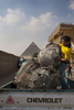 Walid, a young Zabaleen man, collects garbage from the streets in front of the pyramids in Cairo. Zabaleen, which literally means “garbage collectors” have assumed a semi-official role as Cairo’s binmen. The Zabaleen men usually do two shifts. They leave at about four or five in the morning, and again at about nine. The poorer Zabaleen use donkey carts, but many earn enough to rent trucks. They then take the garbage back to their homes for the women to sort through for items to recycle.