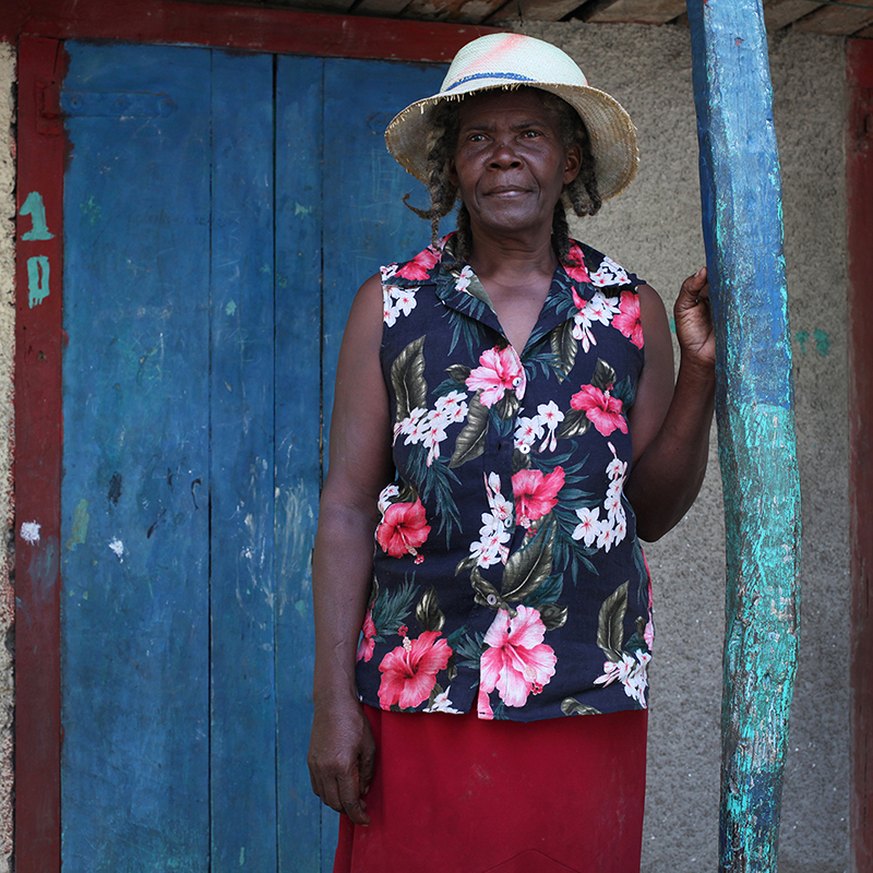 Jeunesse Dubois, 64Jeunesse was born and raised in Kabik. She lives with her daughter and grandchildren. She sells coffee for a living. She buys coffee that comes from the mountains above her home, roasts it, grinds it and then sells it to people in her community.