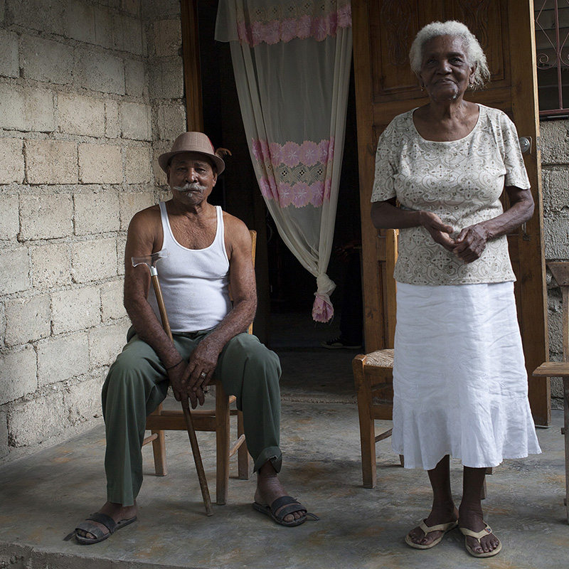 Morice and Servilie HyppolyteMorice and Servilie have been married for sixty two years. They did not tell me their age. They were both born and raised in Marigot and have always lived there. Morice tells me that he does not like to visit Port-au- Prince. He always worked as a gardener and fisherman but has a back injury that is preventing him from working now. Morice and Servilie have children, grandchildren and extended family that help them. When I asked them what makes a marriage last for 62 years they told me “ health, love, family and the grace of God.”