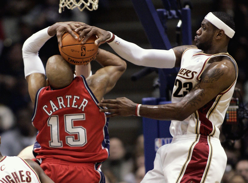 Cleveland Cavaliers Lebron James blocks a shot by the New Jersey Nets VInce Carter.