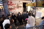 A bride is leaving an East Broadway beauty parlor ahead of her Thanksgiving wedding. 