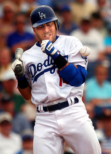 Los Angeles Dodger catcher, Paul LoDuca, winces after getting hit in the arm by a pitch from Detroit Tigers pitcher, Andy Van Hekken, in the first inning at Holman Stadium in Vero Beach.  LoDuca was not seriously injured and the Dodgers went on to win 6-5 in the Grapefruit League season opener.