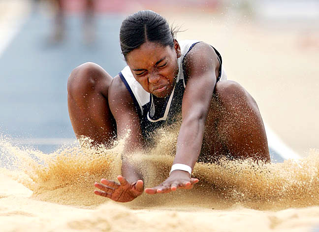 Sherice Walker of Cummings High School completes one of three preliminary round long jumps during the NCHSAA 2-A track and field state championship at N.C. A&T on Friday, May 18, 2007.
