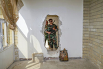 2017. Bashiqa. Iraq. Kurdish Peshmerga pose in ISIS movement holes in a church in Bashiqa.