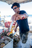 Preparing and sampling fresh conch and conch salad in Nassau, Bahamas
