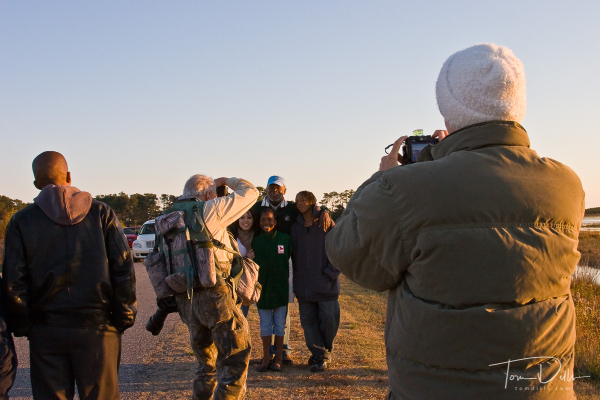 Ann Larsen taking a picture of Edgar Payne taking a picture of Don Brown and his family at Chincoteague NWR.
