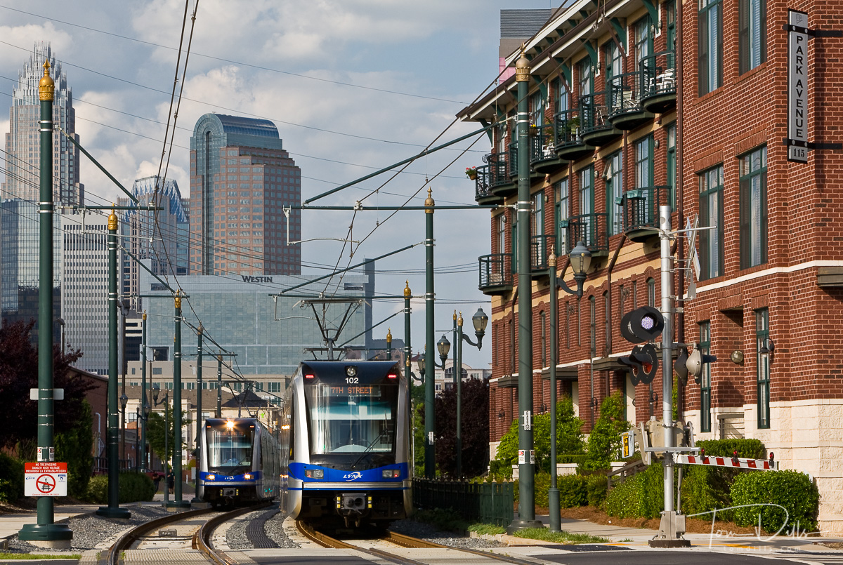 Charlotte's Lynx light rail with Charlotte Skyline in background
