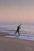 A fisherman casts his line into the surf at Chincoteague Island National Wildlife Refuge, Assateague Island, Virginia