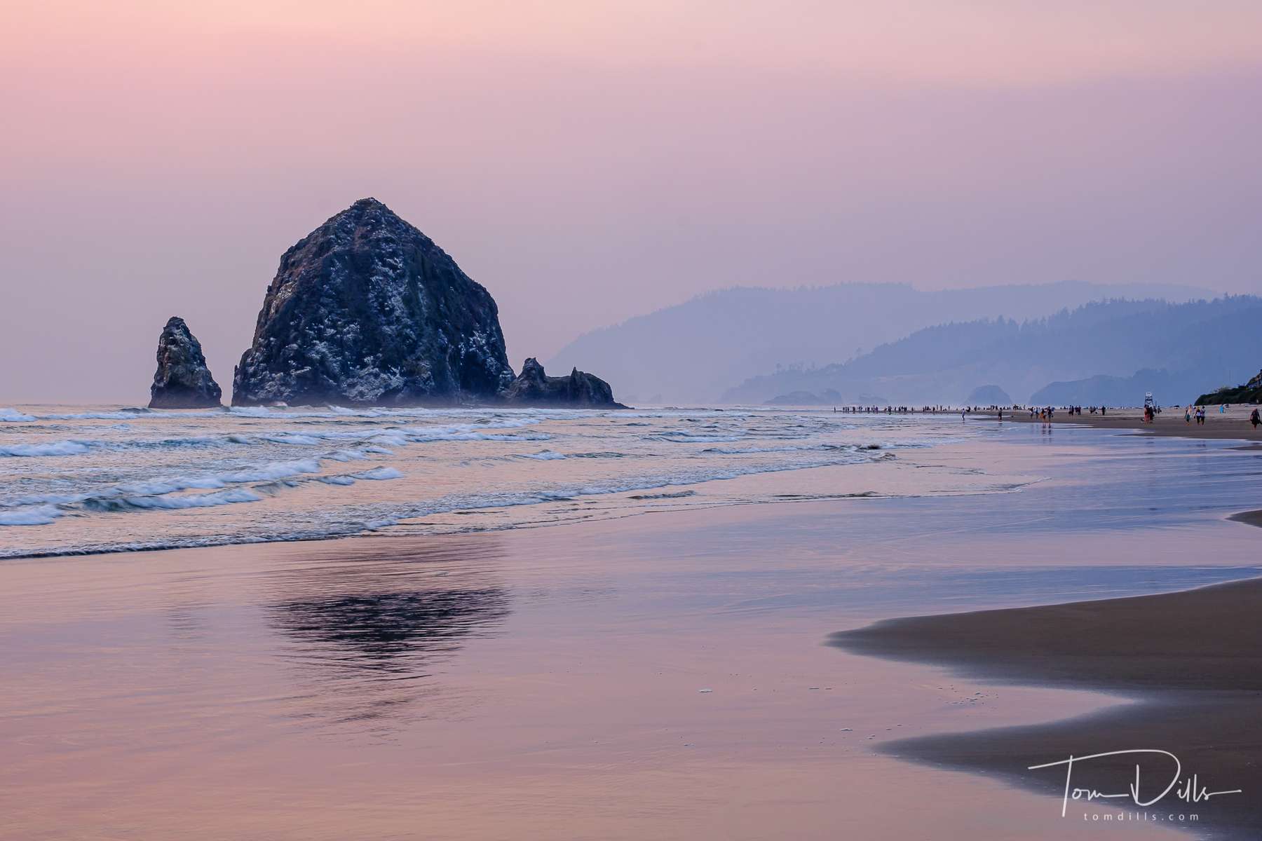 Haystack Rock at sunset over the Pacific Ocean from Cannon Beach, Oregon