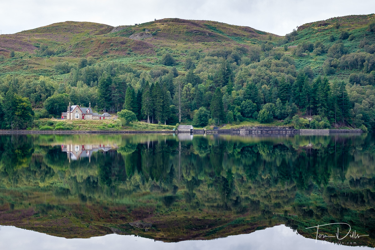 Royal Cottage on the shore of Loch Katrine from aboard the steamship Sir Walter Scott
