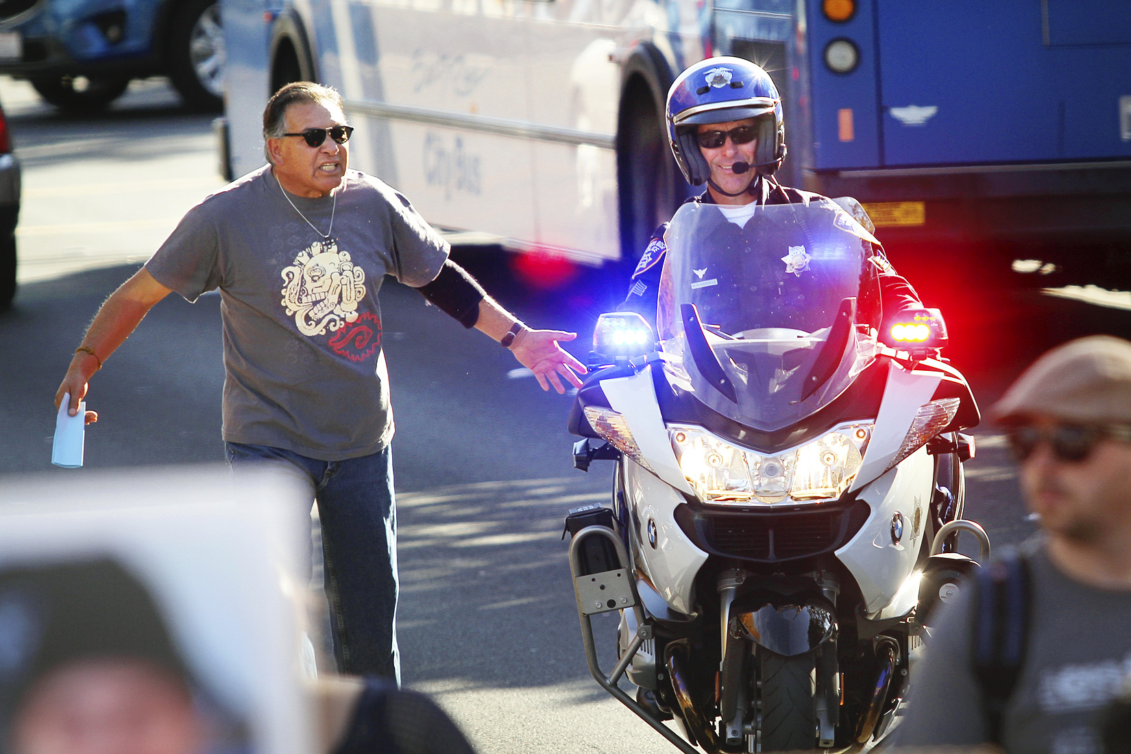 Carlos Lopez argues with a Santa Rosa police officer during a march towards the County of Sonoma Office of the District Attorney to protest the death of Andy Lopez in Santa Rosa on Tuesday, November 5, 2013. (Conner Jay/The Press Democrat) 