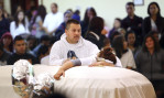 Sujey Lopez clutches the coffin holding her 13-year-old son as he husband Rodrigo Lopez consoles her during Andy Lopez's funeral ceremony funeral ceremony at Resurrection Parish in Santa Rosa on Tuesday, October 29, 2013. (Conner Jay/The Press Democrat) 