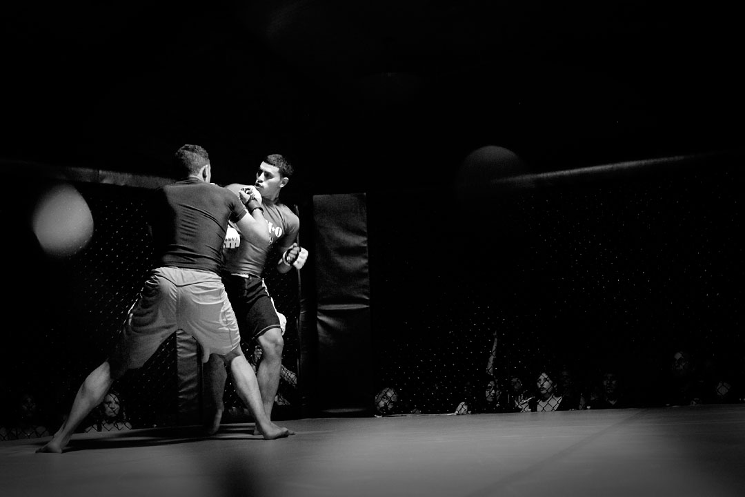 Nikko Jackson and Eric Prado exchange punches during their fight in the Central Coast Throwdown cage fights. 