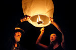 Tom Stone and Roben Vargas release a Chinese lantern with a written message to their late son late Salvatore Vargas on Friday in Prunedale. The lanterns which, floated into the night sky, were meant to celebrate the life of Salvatore who was shot and killed August 15 in Castroville.