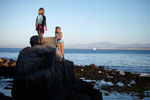 Jett Clarkson, 7, and Alexa Mayer, 6, take advantage of Thursday's warm weather with their families along the beach at Lovers Point Park in Pacific Grove. If you’ve taken advantage of the Spring-like winter weather with an evening stroll yet, don’t worry, according to the National Weather Service this weekend offers another opportunity.