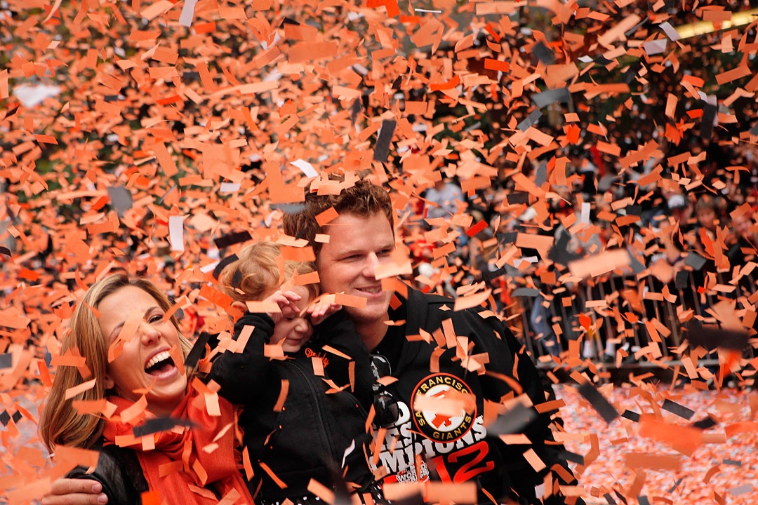 Matt Cain with his wife Chelsea and young daughter Hartley become engulfed in confetti during the San Francisco Giants World Series parade down Market Street in San Francisco. 