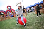 Jeremy Gomez, 5, of Salinas rides a bouncy ball in the Kid's Corral during Thursday's California Rodeo Salinas. The Kid's Corral is free to those attending the Rodeo and offers family friendly entertainment.