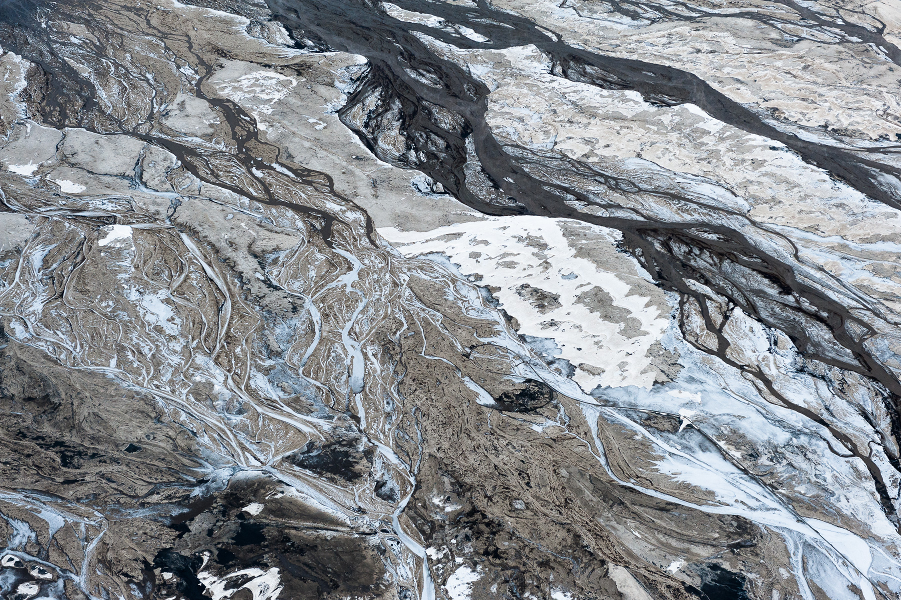 Even in the extreme cold of the winter, the toxic tailings ponds do not freeze. On one particularly cold morning, the partially frozen tailings, sand, liquid tailings and oil residue, combined to produce abstractions that reminded me of a Jackson Pollock canvas.