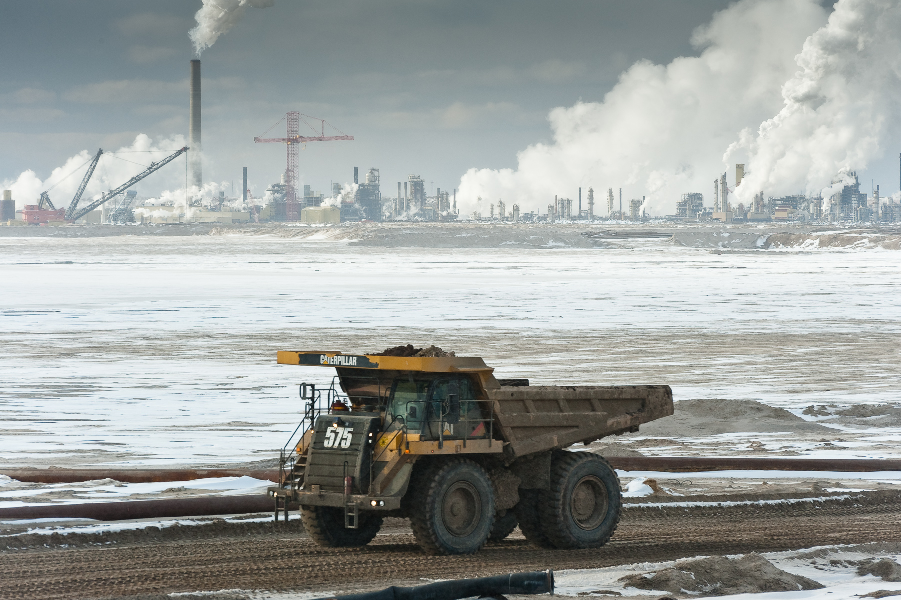 Tar Sands, March 2010. Syncrude frozen tailings pond and Mildred Lake Upgrader in background and dumptrucks. Athabasca Tar Sands, Alberta, Canada.Fine Art Print Price ListOpen and Larger Edition Prints. These are produced to the same high standards as our limited edition prints and offer collectors a more affordable way to get to know our work.Prints  are limited to an edition of 50 in each size above 20” X 24”. Prices are for prints only and do not include tax or shipping.All prices are in US dollars.			12”x18” 					$350.16”x24” 				       $650.20”x30” 					$1000.24”x36” 				       $1500. 30”x45” 					$2300.40”x60”				      $3600