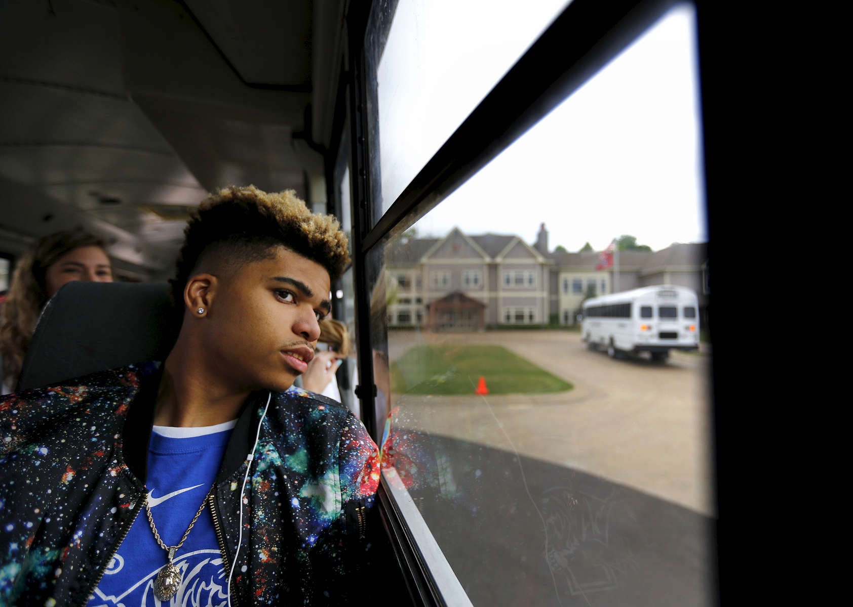 May 16, 2016 - Zearius Jenkins looks out the window of a bus as it departs from the St. George's Independent School Collierville campus filled with the senior class departing on their {quote}Trip to Nowhere{quote}. The field trip is a school tradition in which seniors are taken on an excursion by administrators during their final week of school to a secret location. The busses later pulled up to Autozone Park for the student to take in an afternoon ball game. (Mike Brown/The Commercial Appeal)