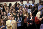 May 9, 2016 - St. George's students, along with head of school J. Ross Peters (bottom, left), say the Pledge of Allegiance before the start of an upper-school chapel service in the school's gym. Later during the service senior Will Courtney stepped to the microphone and took the students and administration to task for what he described as a {quote}noble{quote} experiment that was failing. With only five of the original 19 students who started the first class at the Memphis campus graduating many had been weeded out or left behind, and he noted the visible racial divides in school settings such as the lunchroom and chapel services. {quote}We look for comfort in our groups. I think it's a mistake to place too much value on which groups sit together. People look for shared backgrounds, shared experiences.{quote} Peters later said. (Mike Brown/The Commercial Appeal)