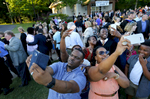 May 22, 2016 - Family members surround Donovan Borum to make selfies with their star moments after his graduation ceremony ended on the St. George's Collierville campus. With a full-ride scholarship to Wake Forest University worth more than $60,000 Borum will be the first member of his family to attend a four-year university. (Mike Brown/The Commercial Appeal)