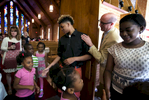 May 23, 2016 - St. George's head of school J. Ross Peters taps Zearius Jenkins on the shoulder as Jenkins and Erica Stevenson shake hands with young students following a chapel service at the Memphis campus the day after graduation. {quote}The real work is beginning.{quote} Peters said. {quote}This is the moment when we grow in our full selves. This is the model coming to its first fruition.{quote} Jenkins, Stevenson and a handful of others were among the first students to ever walk the halls at the Memphis campus and are members of the first graduating class under the three-campus model the school began more than a decade ago. (Mike Brown/The Commercial Appeal)
