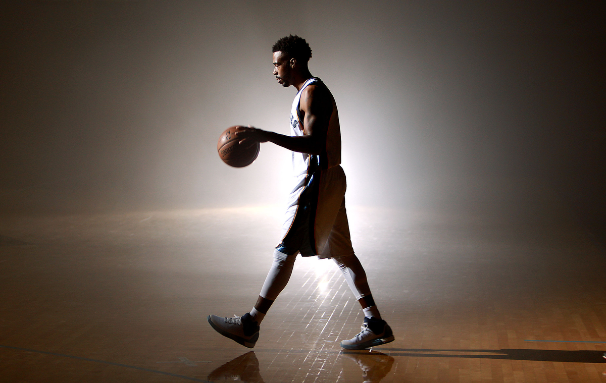 September 28, 2015 - Mike Conley walks across the practice court for a video shoot during the Memphis Grizzlies media day at FedExForum. (Mike Brown/The Commercial Appeal)