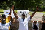 July 12, 2016 - Antonio Cathey (center) and others with the Black Lives Matter movement chant during a rally outside Graceland on Elvis Presley Blvd Tuesday afternoon. Roughly 60-70 people gathered peacefully outside the gates of the famous tourist destination. (Mike Brown/The Commercial Appeal)