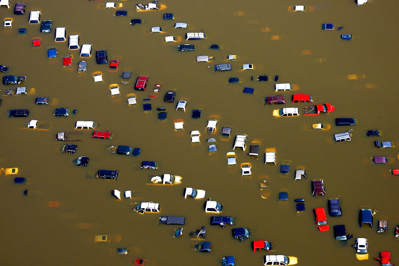 May 10, 2011 - Cars lie submerged in overflow water from the Wolf River on McMiller Road near Jackson. After weeks of rising to historic levels the Mississippi River reached a crest just shy of the forecasted 48 feet at the Memphis gauge. {quote}It's going to meander around that level for the next 24 to 36 hours,{quote} meteorologist Bill Borghoff said. {quote}We're going to pretty much hold onto the crest for a while.{quote} (Mike Brown/The Commercial Appeal)