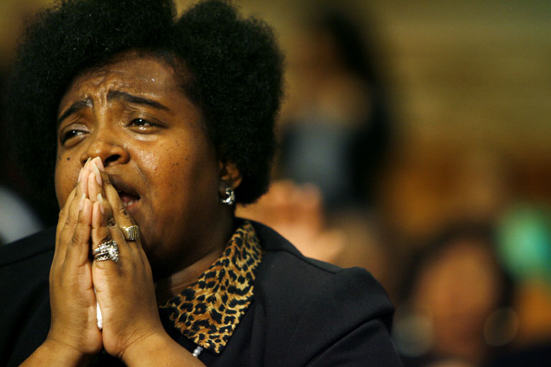 Dujuna Chambers, of Memphis, prays during the Prayer of Intercession and Supplication at Mason Temple Monday morning. The event marked the unofficial kick-off to the Centennial Holy Convocation.(Mike Brown/ Memphis Commercial Appeal)