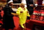 Vicki Williams, of Denver, CO, dances through the aisle in Mason Temple after testifying about receiving a helping hand to afford her pilgrimage to the 100th annual Holy Convocation. She also spoke about a phone call she received after her arrival in Memphis from her son, whom she never thought she would see again, saying he had been released from prison despite a life sentence. Many filling the historic church, named after COGIC founder Mason Temple, got on stage and testified of miracles in their lives since arriving in Memphis for the convocation.(Mike Brown/ Memphis Commercial Appeal)