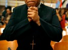 Janaina Dasilva, from Oakland, CA, prays during the Prayer of Intercession and Supplication at Mason Temple.(Mike Brown/ Memphis Commercial Appeal)