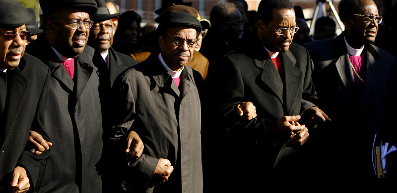 (l-r) Bishops Jerry W. Macklin, Roy L. H. Winbush, Presiding Bishop Charles E. Blake and Phillip A. Brooks are among those leading the march to Mason Temple from Crump with their arms locked together.(Mike Brown/Memphis Commercial Appeal)