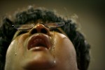 Tears of joy stream down the face of Mother Sharon A. Manning, from Waterbury, Connecticut, as she throws her head back in prayer while speaking in tongues during 100th annual COGIC Holy Convocation.(Mike Brown/Memphis Commercial Appeal)