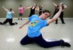 Kenny Thielemier, 23, closes a dance with grace during practices with Company d, a performing arts troupe for individuals with Down Syndrome. The group performs around town regularly and has even performed at an official off-Broadway venue in New York City. 
