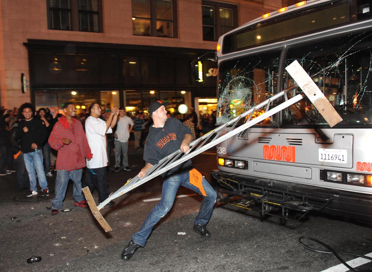 Gregory Graniss smashes a Muni bus windshield with a police barricade in San Francisco after the Giants won the World Series on October 28, 2012. Graniss was later charged with felony vandalism and pleaded not guilty.