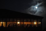 Diners are seen at the Beach Chalet underneath the full harvest moon on September 22, 2010. 