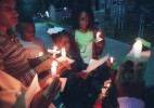 Family members hold a candlelight vigil where Derrick Mushatt, 28, was shot.