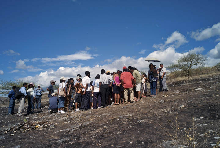 Amazonians gather at a memorial site whose grounds are charred as the result of a clash between indigenous natives, local migrants and the Peruvian national police. 