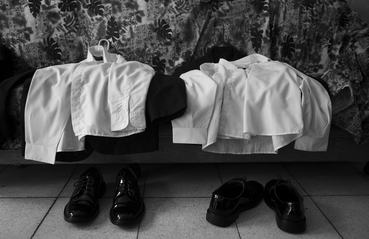 Clothes are set aside for two young Afro-Peruvian men who will work as camalenque during an afternoon funeral.