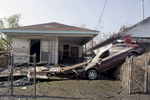 September 14, 2005 - New Orleans, Louisiana -  Homes and vehicles were heavily damaged in this Ninth Ward neighborhood. 