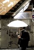 tokyo-guy-under-umbrella
