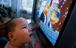 An 11-year-old child sees a television for the first time. The volunteers donated the television and some DVDs to the orphanages in order to provide at least some stimulation.