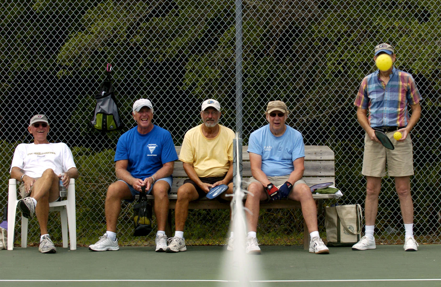 Pickleball players watch the ball go back and forth as they sit out a game. Pictured are Adolph Netzel, left to right, Dan Toothman, Bob Leonard, Wayne Tucker and Gary Anderson. 